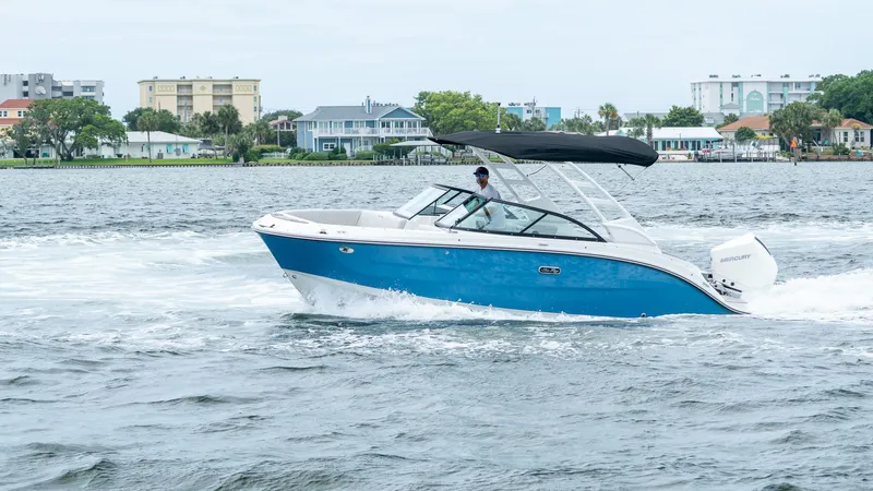 Slide: The Image of 2026 Sea Ray SDX 230 Outboard on water, blue design. - 8