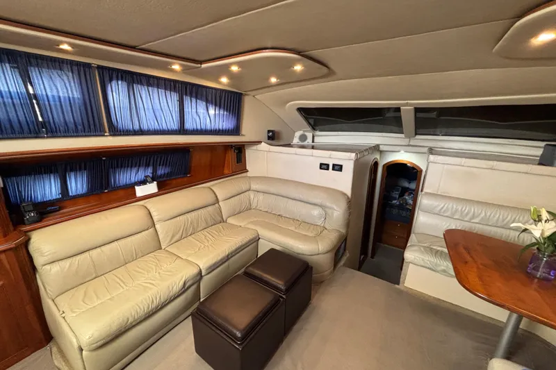 Slide: The Image of Luxurious interior of 2005 Cruisers Yachts 455 Express Motoryacht with leather seating cherrywood table and elegant decor. - 13