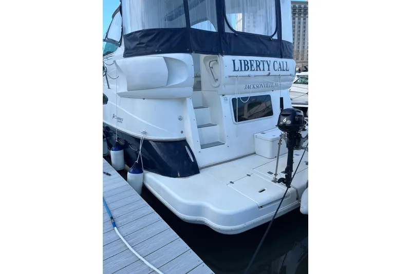 Slide: The Image of 2005 Cruisers Yachts 455 Express Motoryacht swim platform and boarding steps to aft deck - 2