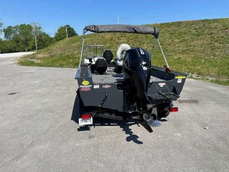 Slide: The Image of 2019 Tracker Targa V18 boat with outboard motor on parking lot. - 11