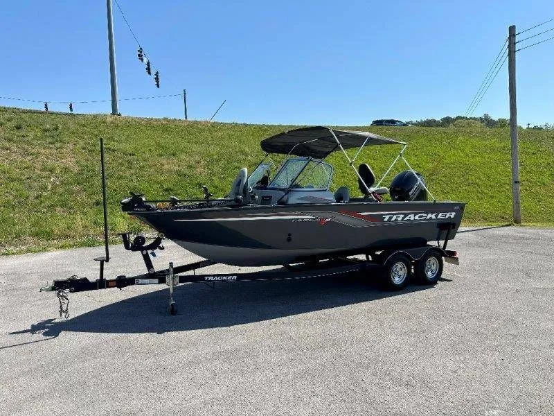 Slide: The Image of 2019 Tracker Targa V18 boat on trailer outdoors. - 15