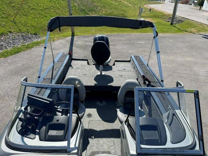 Slide: The Image of 2019 Tracker Targa V18 boat with open cockpit and Bimini top. - 30