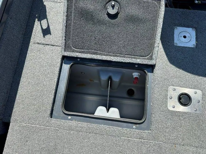 Slide: The Image of 2019 Tracker Targa V18 boat with open storage compartment. - 47