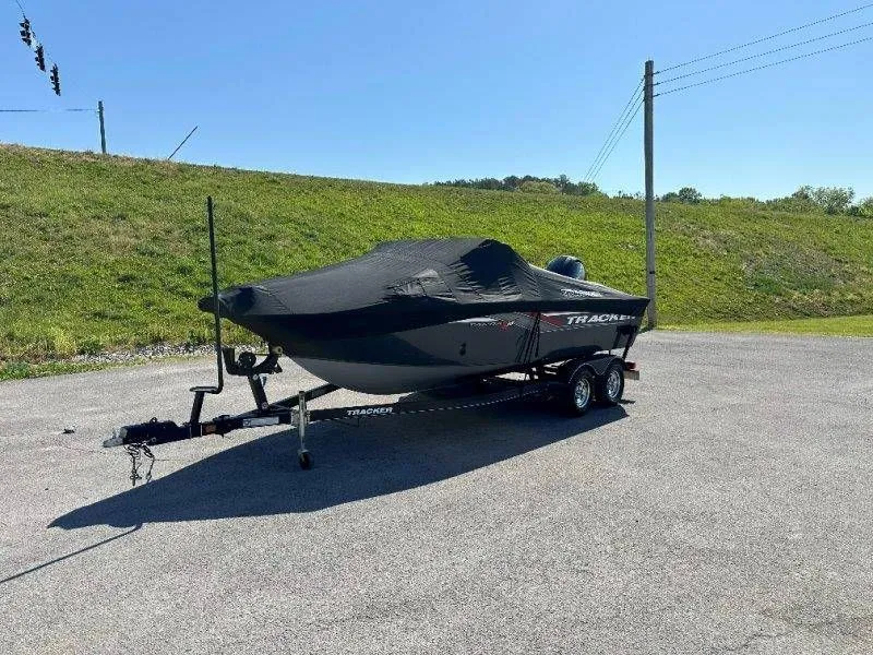 Slide: The Image of 2019 Tracker Targa V18 boat with cover on trailer. - 48