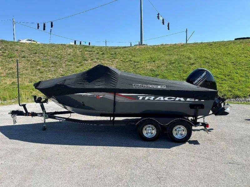 Slide: The Image of 2019 Tracker Targa V18 boat with cover on trailer. - 49