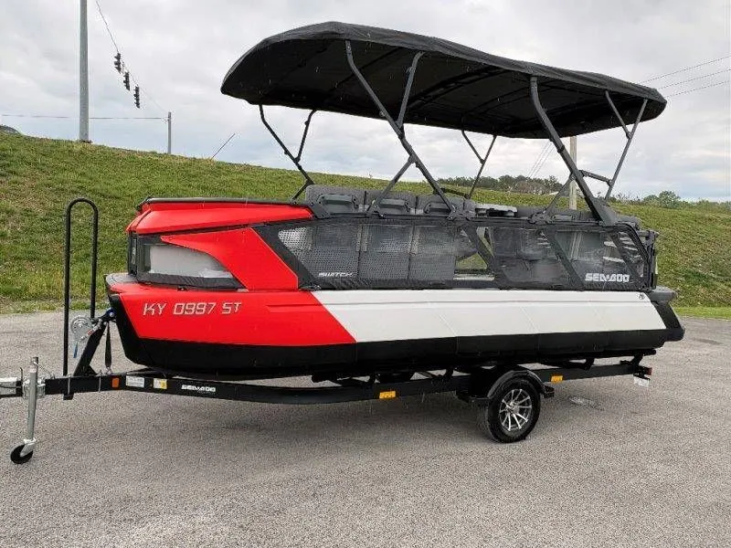 Slide: The Image of 2023 Sea-Doo Switch Cruise 21 on trailer, red and black, side view. - 11