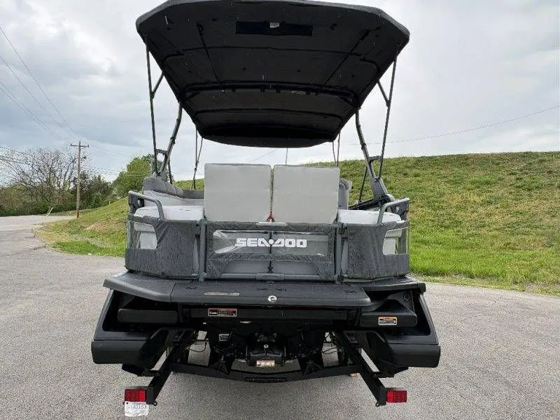 Slide: The Image of Rear view of 2023 Sea-Doo Switch Cruise 21 on a road. - 13
