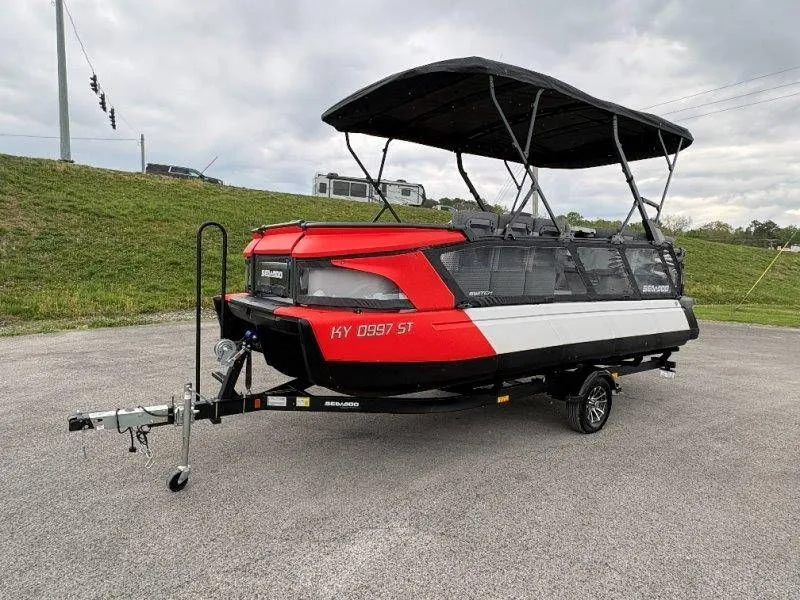 Slide: The Image of 2023 Sea-Doo Switch Cruise 21 on trailer, red and white design. - 15