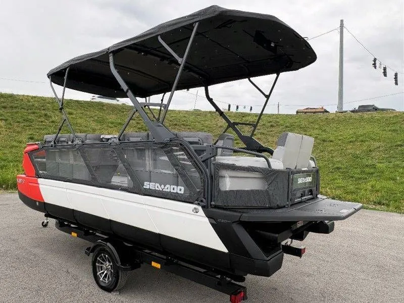 Slide: The Image of 2023 Sea-Doo Switch Cruise 21 pontoon boat on trailer. - 16