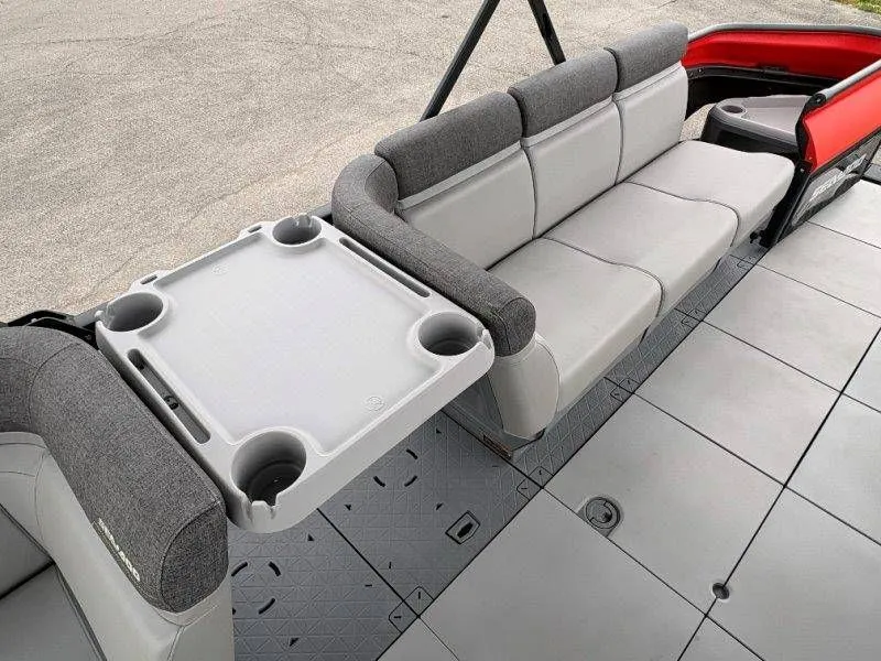 Slide: The Image of Interior of 2023 Sea-Doo Switch Cruise 21 with gray seating and table. - 30