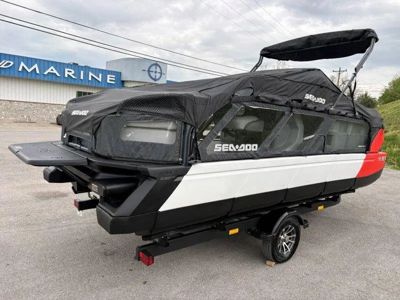 Slide: The Image of 2023 Sea-Doo Switch Cruise 21 with cover on trailer. - 48