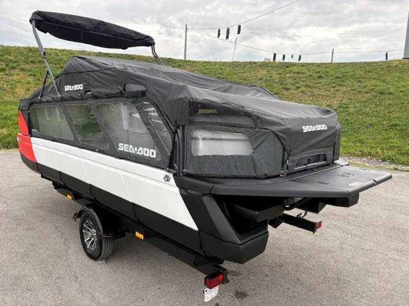 Slide: The Image of 2023 Sea-Doo Switch Cruise 21 with cover on trailer. - 49