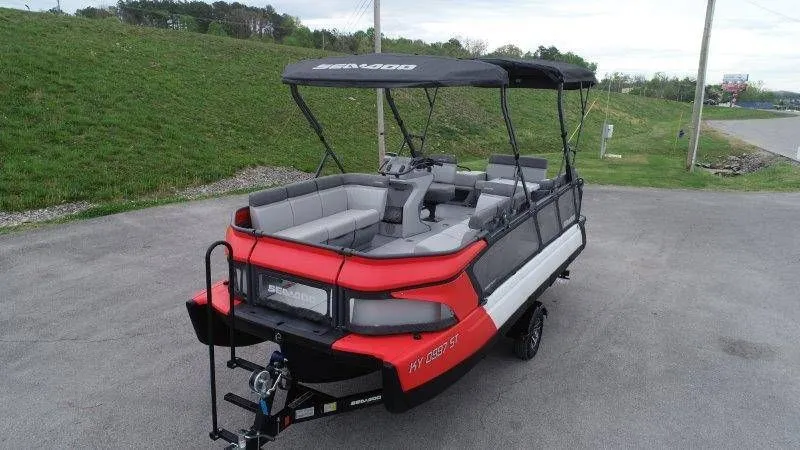 Slide: The Image of 2023 Sea-Doo Switch Cruise 21 on trailer, red and gray design. - 6