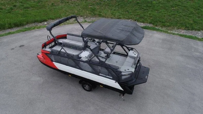 Slide: The Image of 2023 Sea-Doo Switch Cruise 21 pontoon boat on trailer, side view. - 8