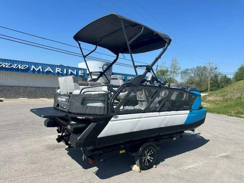 Slide: The Image of 2022 Sea-Doo Switch Cruise 18 pontoon boat on trailer. - 12