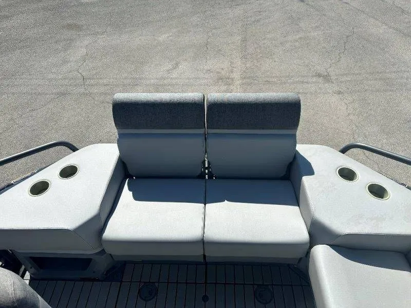 Slide: The Image of Rear seating of 2022 Sea-Doo Switch Cruise 18 with cup holders. - 22
