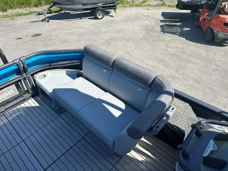 Slide: The Image of 2022 Sea-Doo Switch Cruise 18 seating area on boat dock. - 26