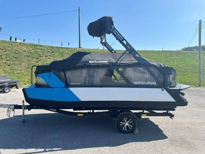 Slide: The Image of 2022 Sea-Doo Switch Cruise 18 on trailer, blue and black, side view. - 32