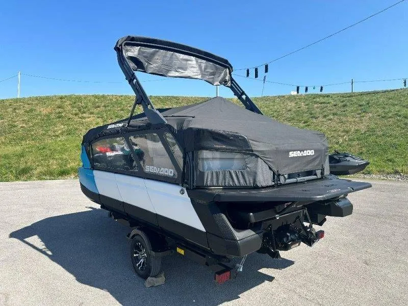 Slide: The Image of 2022 Sea-Doo Switch Cruise 18 on trailer, covered, outdoors. - 34