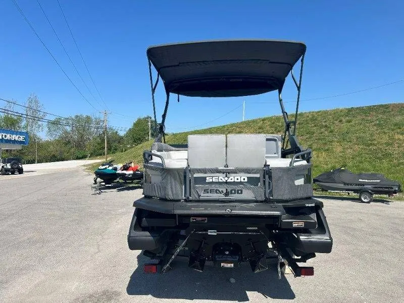 Slide: The Image of Rear view of a 2022 Sea-Doo Switch Cruise 18 on a parking lot. - 7