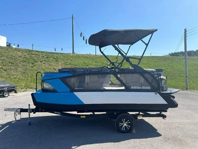 Slide: The Image of 2022 Sea-Doo Switch Cruise 18 on trailer, blue sky. - 8
