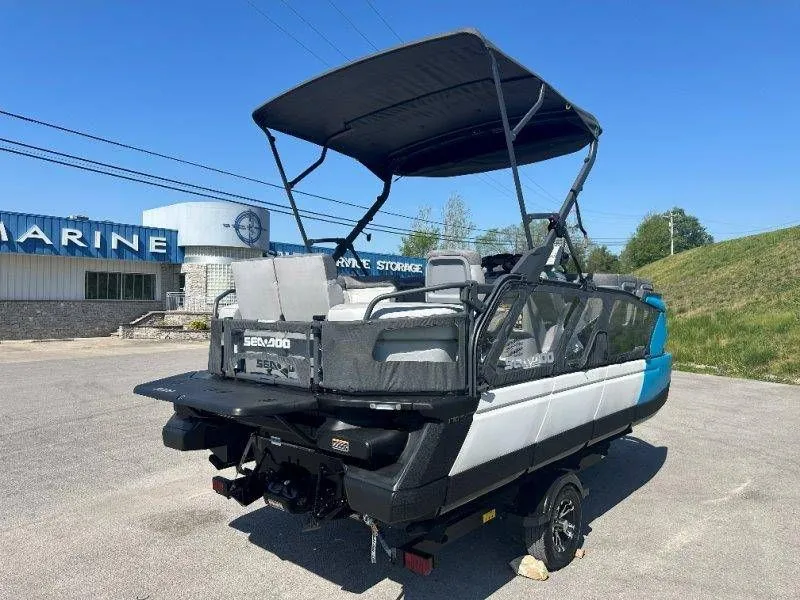 Slide: The Image of 2022 Sea-Doo Switch Cruise 18 parked outside a marine store. - 9