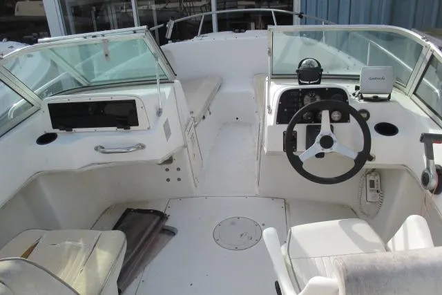 Slide: The Image of 1999 Boston Whaler 20 Ventura Bowrider interior with steering wheel and seating. - 14