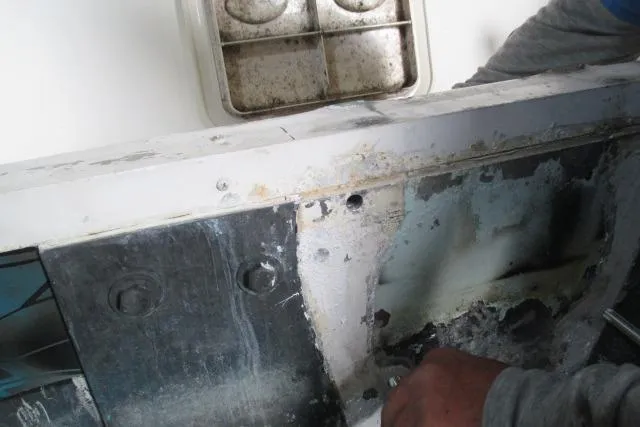 Slide: The Image of Repair work on a 1999 Boston Whaler 20 Ventura Bowrider boat hull. - 7