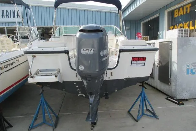 Slide: The Image of 1999 Boston Whaler 20 Ventura Bowrider with Yamaha outboard motor, for sale at marina. - 8