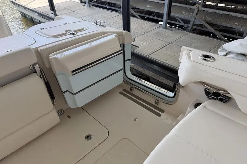 Slide: The Image of 2026 Grady-White Freedom 285 boat interior with seating and storage compartments. - 10