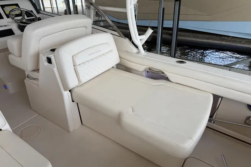 Slide: The Image of 2026 Grady-White Freedom 285 boat interior with luxurious seating and helm station. - 12