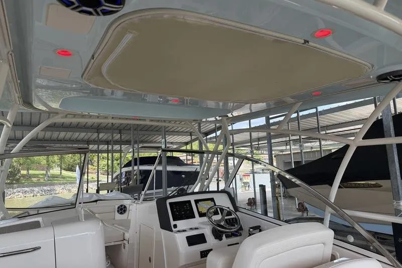 Slide: The Image of Interior view of 2026 Grady-White Freedom 285 boat, featuring modern helm and seating. - 19