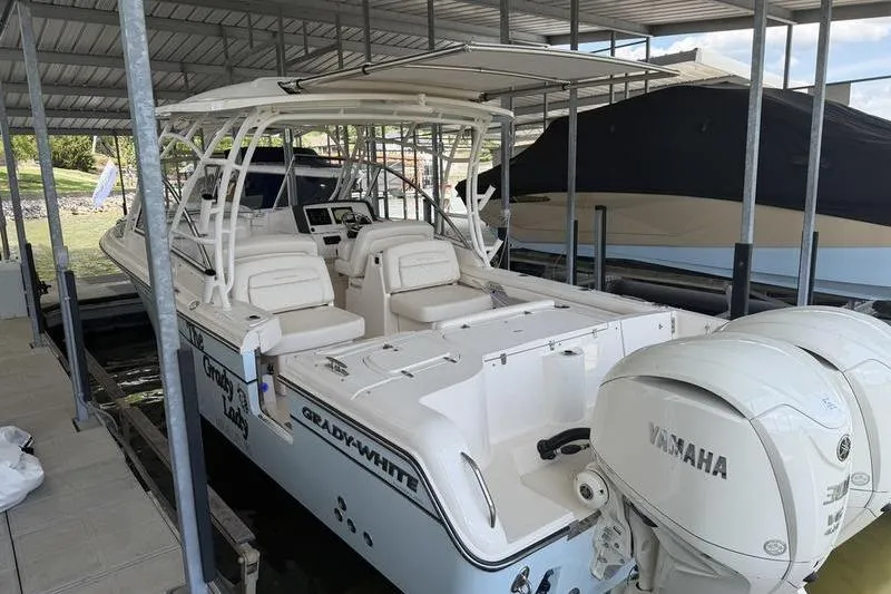 Slide: The Image of 2026 Grady-White Freedom 285 boat docked with Yamaha engines. - 21