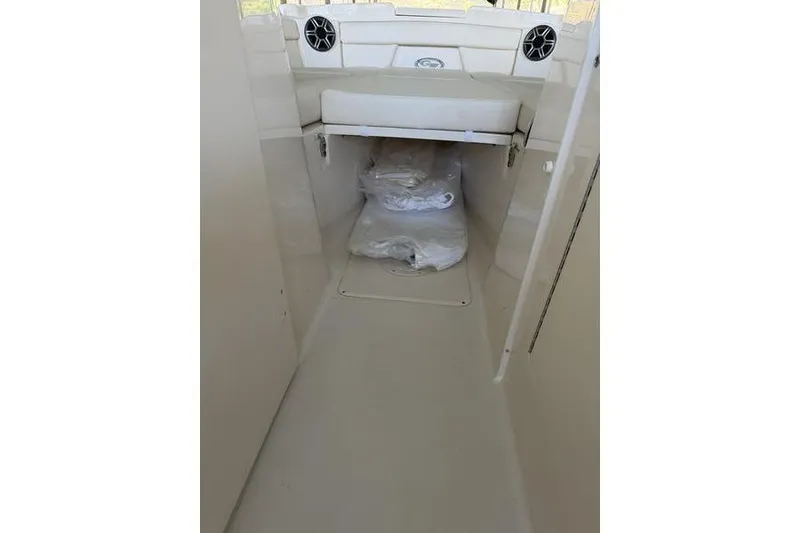 Slide: The Image of 2026 Grady-White Freedom 285 boat interior with storage area and seating. - 26