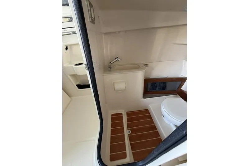 Slide: The Image of 2026 Grady-White Freedom 285 boat interior bathroom with sink and toilet. - 28