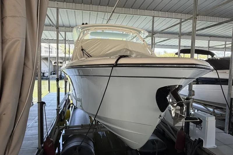 Slide: The Image of 2026 Grady-White Freedom 285 boat docked in covered marina. - 3