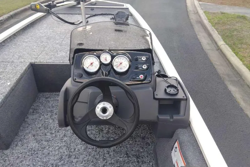 Slide: The Image of Steering console of 2026 Tracker Pro 170 boat with gauges and controls. - 80