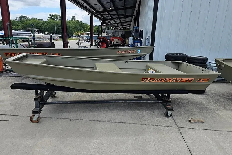The Image of 2026 Tracker Grizzly 12 Jon boat on display in an outdoor setting. - 1