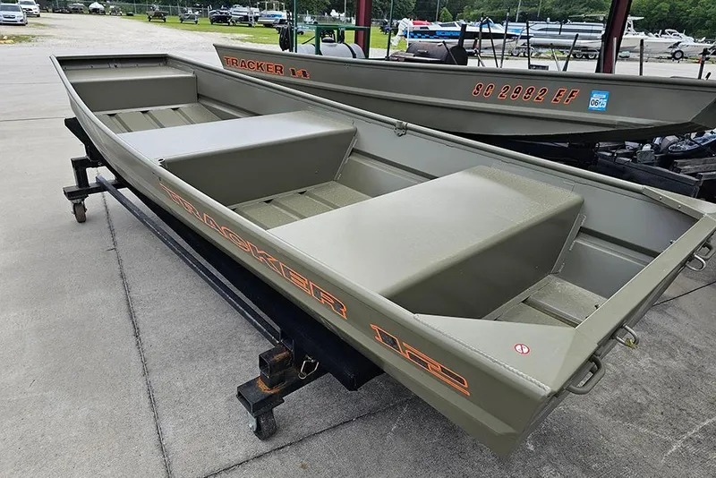 Slide: The Image of 2026 Tracker Grizzly 12 Jon boat on display, featuring durable design and spacious interior. - 4