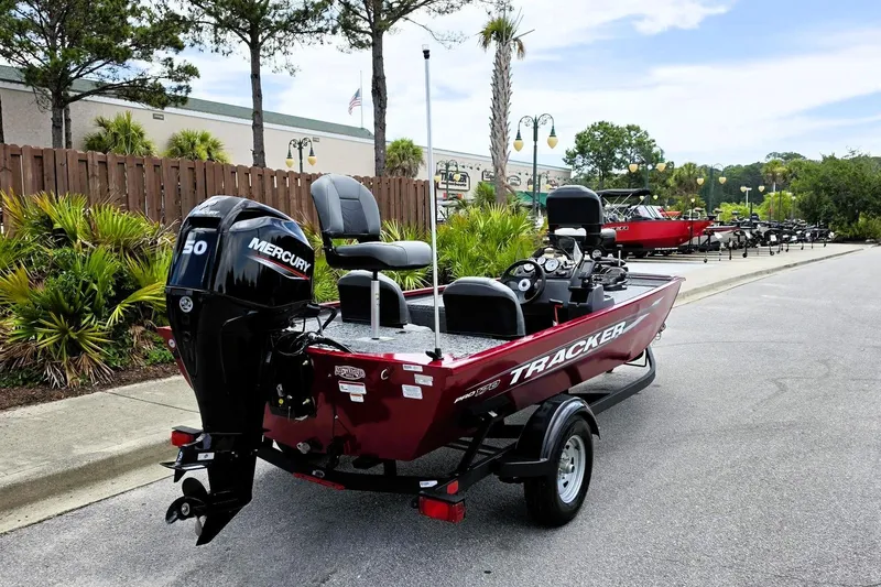 Slide: The Image of 2026 Tracker Pro 170 boat with Mercury 50 engine, parked outdoors. - 3
