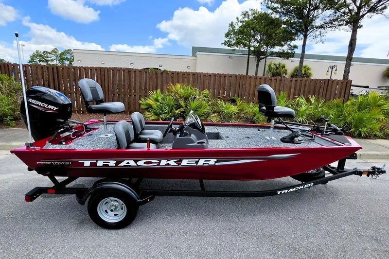 Slide: The Image of 2026 Tracker Pro 170 boat with Mercury engine, parked outdoors on a trailer. - 5