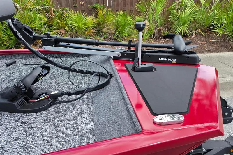 Slide: The Image of 2026 Tracker Pro 170 boat with Minn Kota trolling motor on red deck. - 12