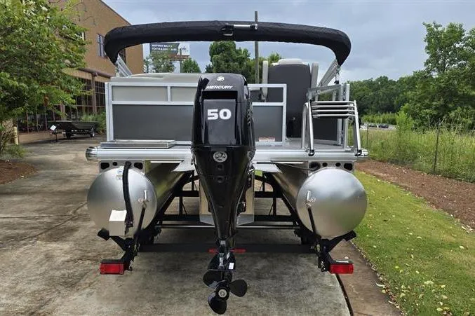 Slide: The Image of 2026 Sun Tracker Bass Buggy 16 XL Select pontoon boat with Mercury 50 HP engine, rear view. - 4