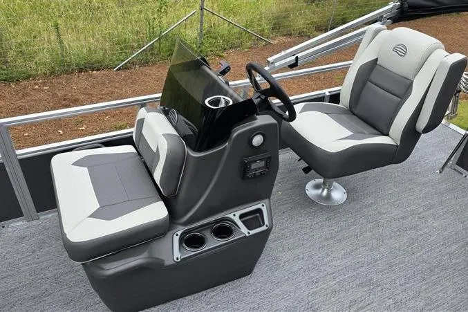 Slide: The Image of 2026 Sun Tracker Bass Buggy 16 XL Select interior with modern seating and steering console. - 8