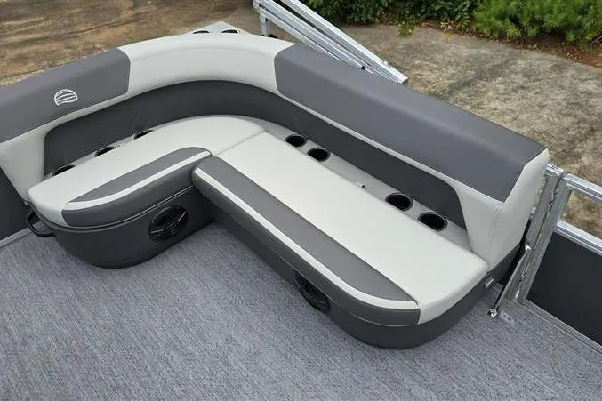 Slide: The Image of 2026 Sun Tracker Bass Buggy 16 XL Select pontoon seating with cup holders and gray upholstery. - 11
