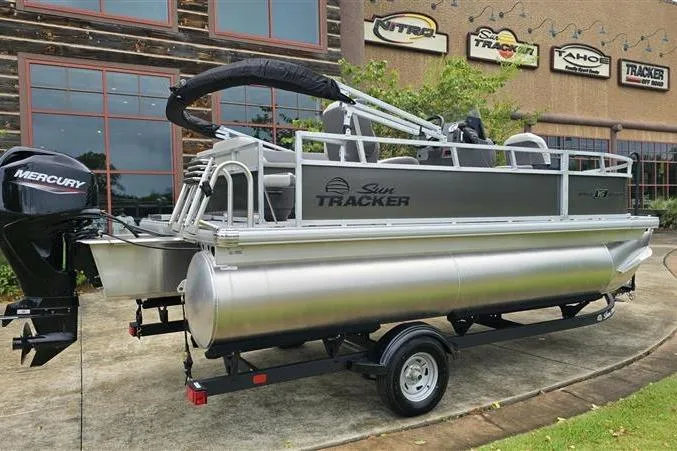 Slide: The Image of 2026 Sun Tracker Bass Buggy 16 XL Select pontoon boat with Mercury engine on trailer. - 5