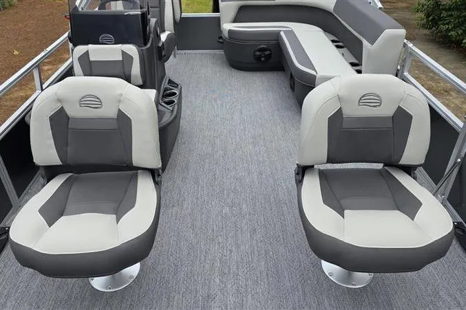 Slide: The Image of 2026 Sun Tracker Bass Buggy 16 XL Select pontoon boat interior with gray seating and carpet. - 12