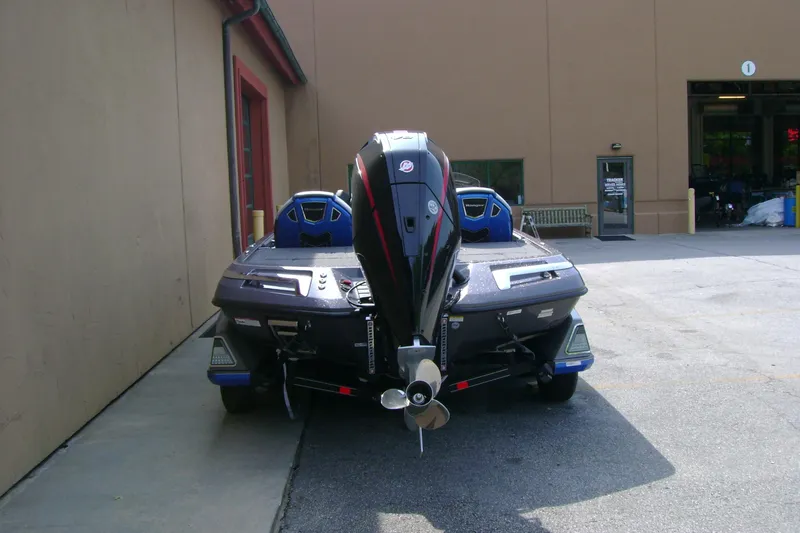 Slide: The Image of 2026 Ranger Z519R Cup-Equipped boat, rear view, parked outside a building. - 6