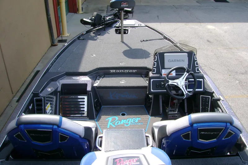 Slide: The Image of 2026 Ranger Z519R Cup-Equipped boat interior with Garmin navigation system and dual seating. - 7