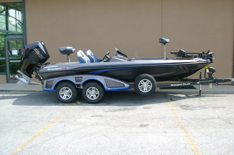 The Image of 2026 Ranger Z519R Cup-Equipped boat on trailer, parked outdoors. - 0